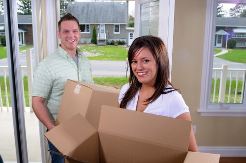 Organised boxes and office furniture stored securely near Crooklog