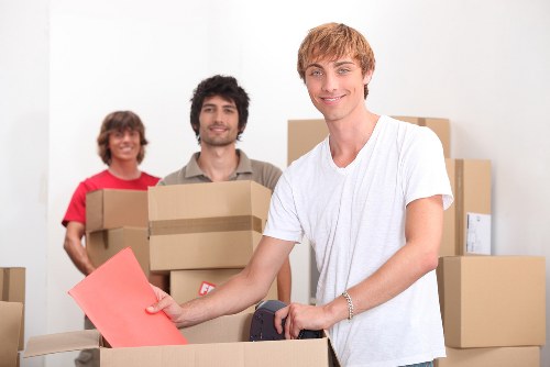 Stacked containers and labeled belongings for household storage